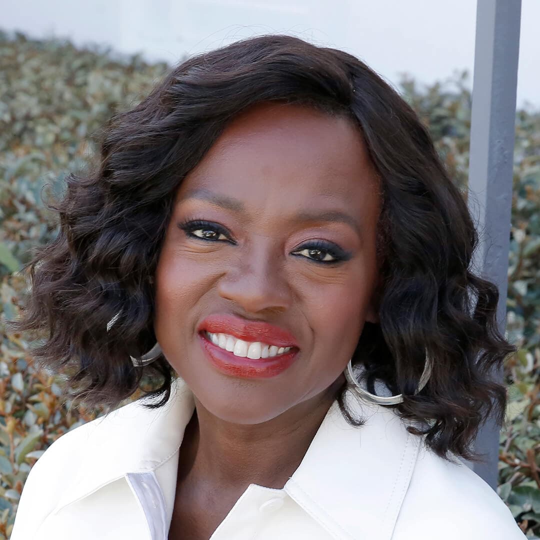 Close-up image of Viola Davis rocking a short and curly hairstyle