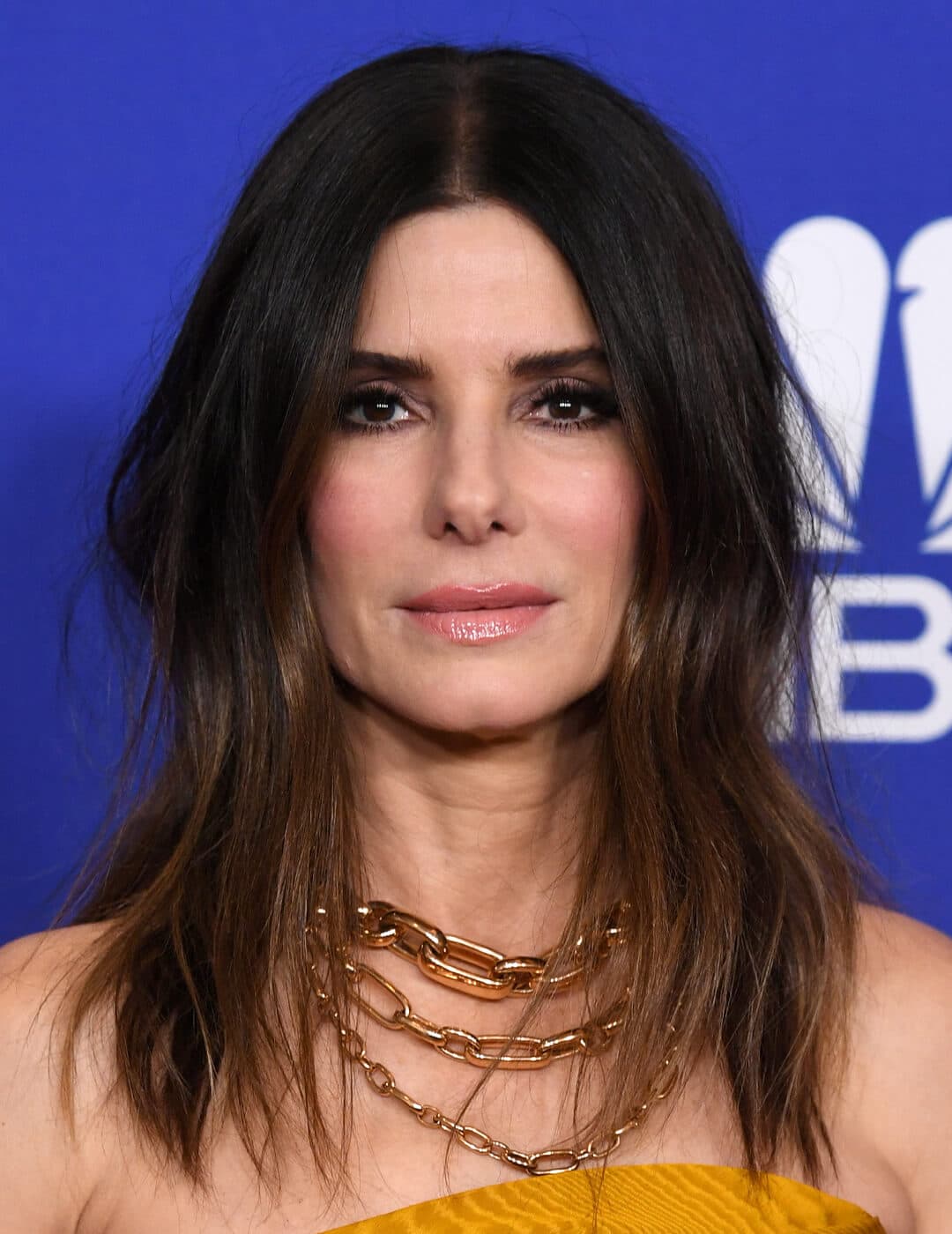 Close-up image of Sandra Bullock with medium length wavy hairstyle