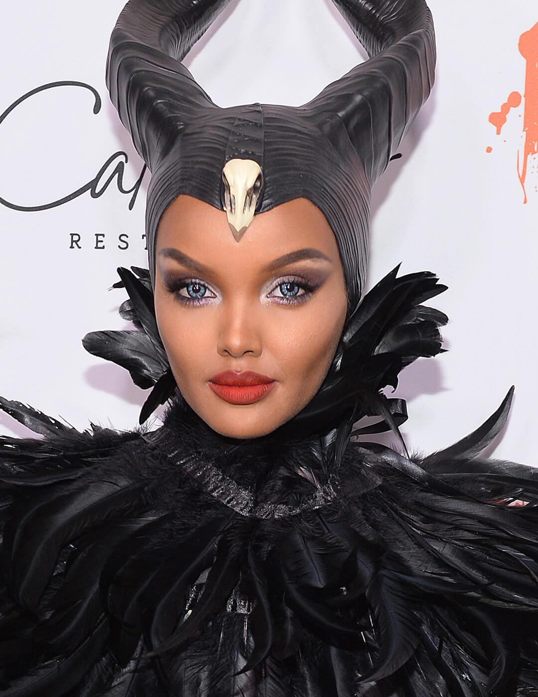 Halima Aden dressed and made up as Maleficent on the red carpet