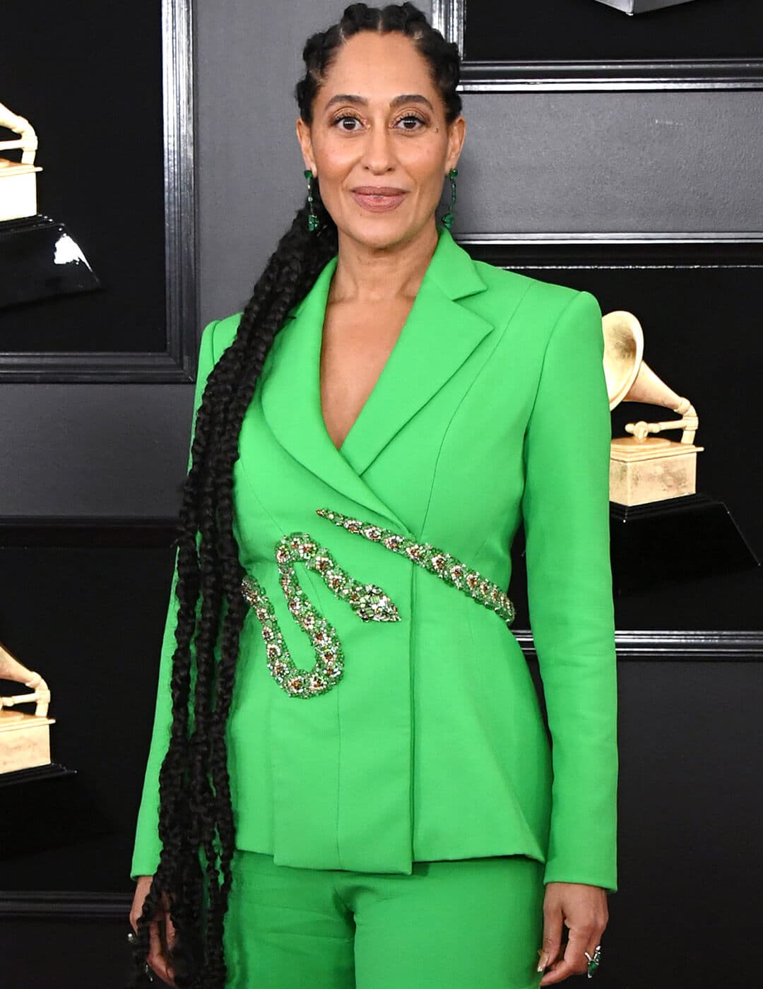 Tracee Ellis Ross rocking a neon green suit with snake belt and long braided ponytail with cornrows