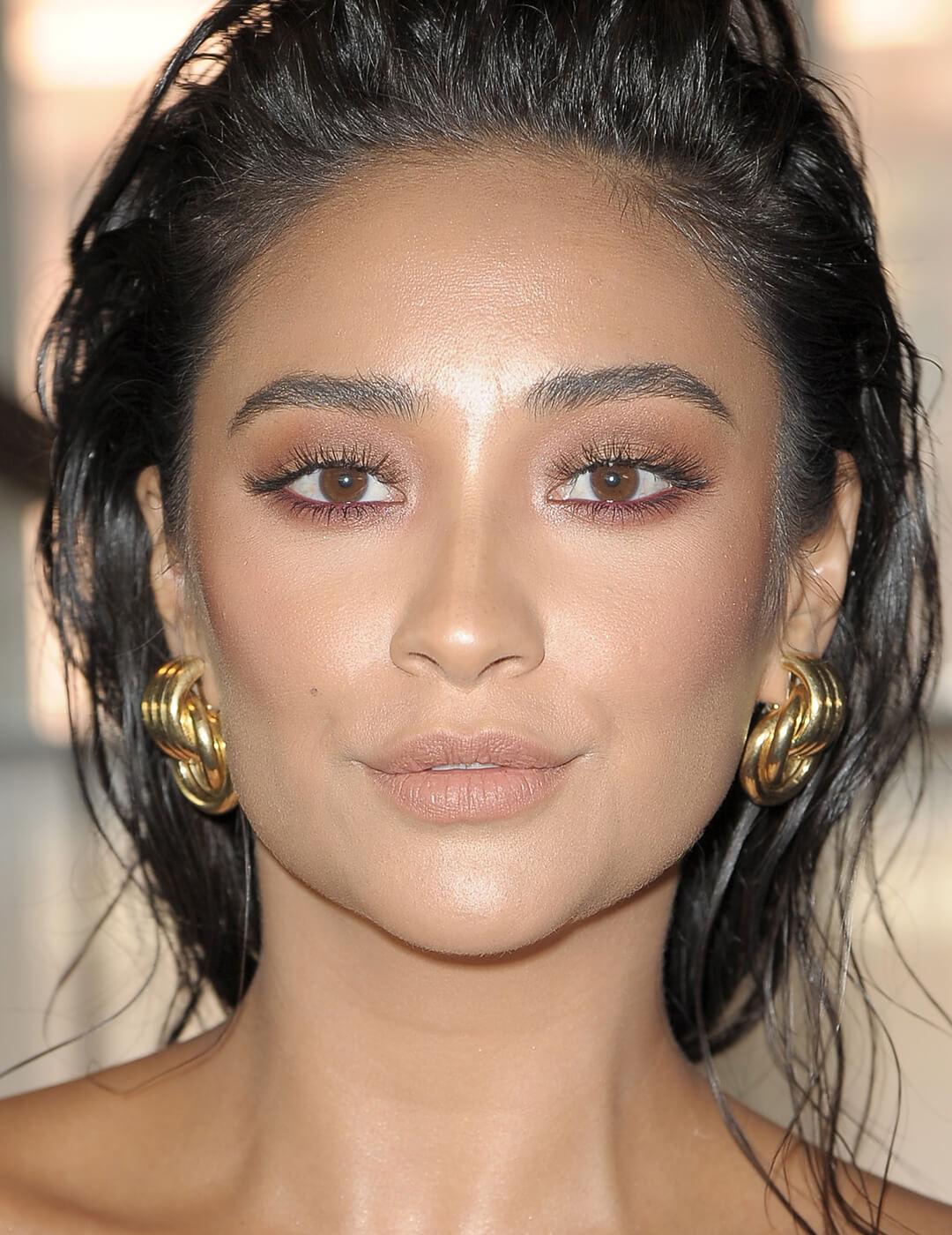 Shay Mitchell rocking a wet look hairstyle and subtle smoky eye makeup look