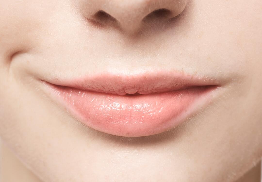 Close-up of a girl's smiling lips