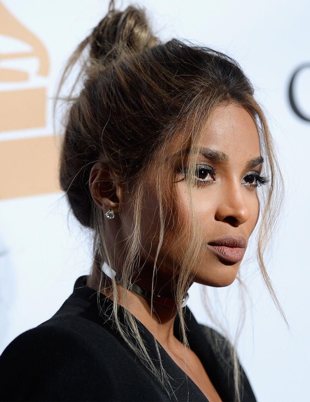 Close-up image of Ciara with an up-do hairstyle and loose bangs