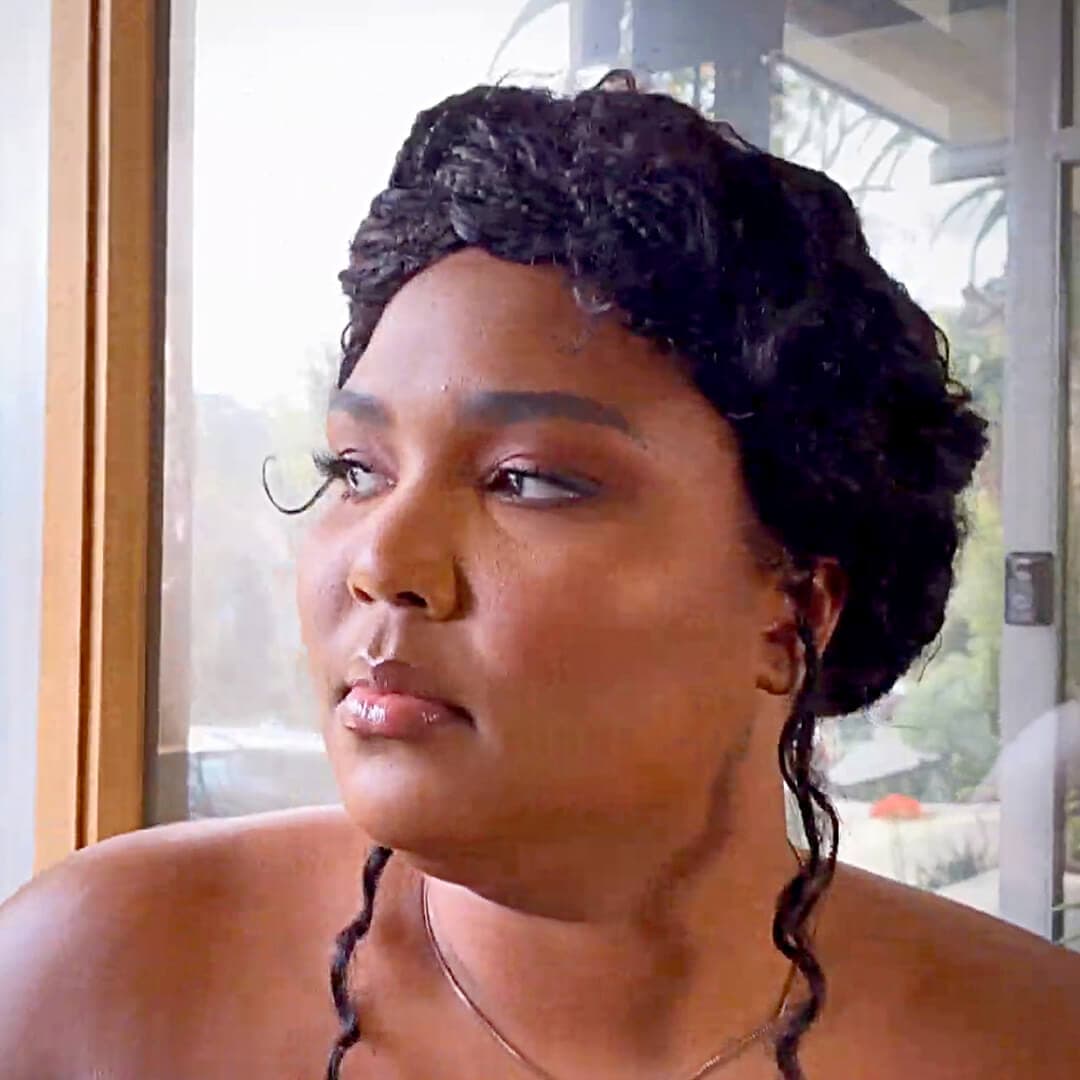 Lizzo sporting a textured halo braided hairstyle