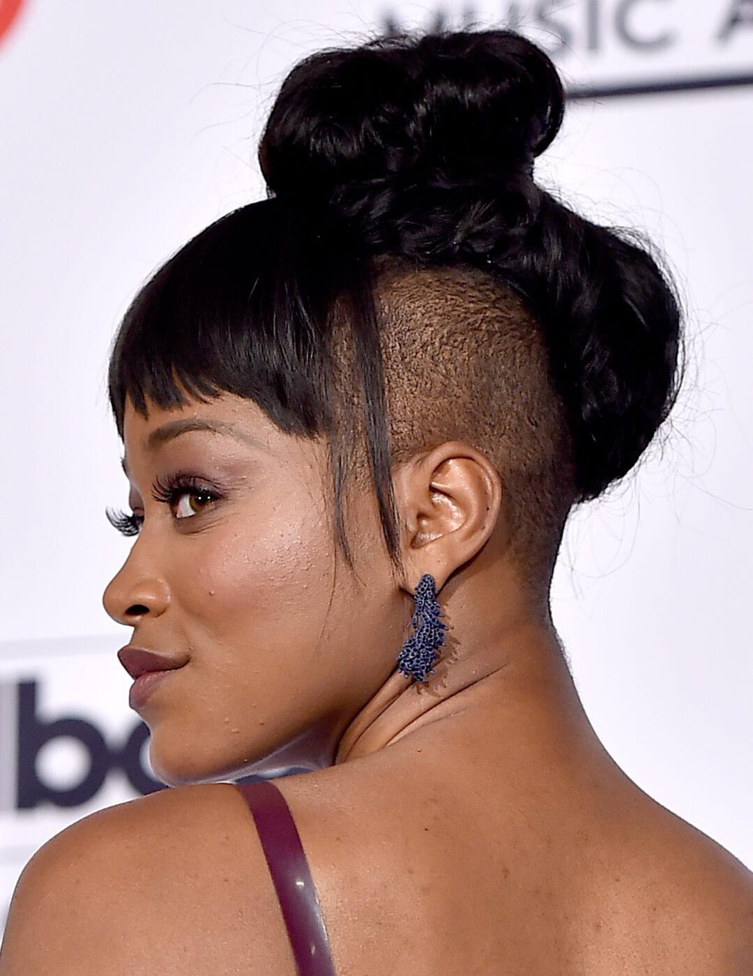 Keke Palmer showing off her top knot undercut hairstyle with bangs