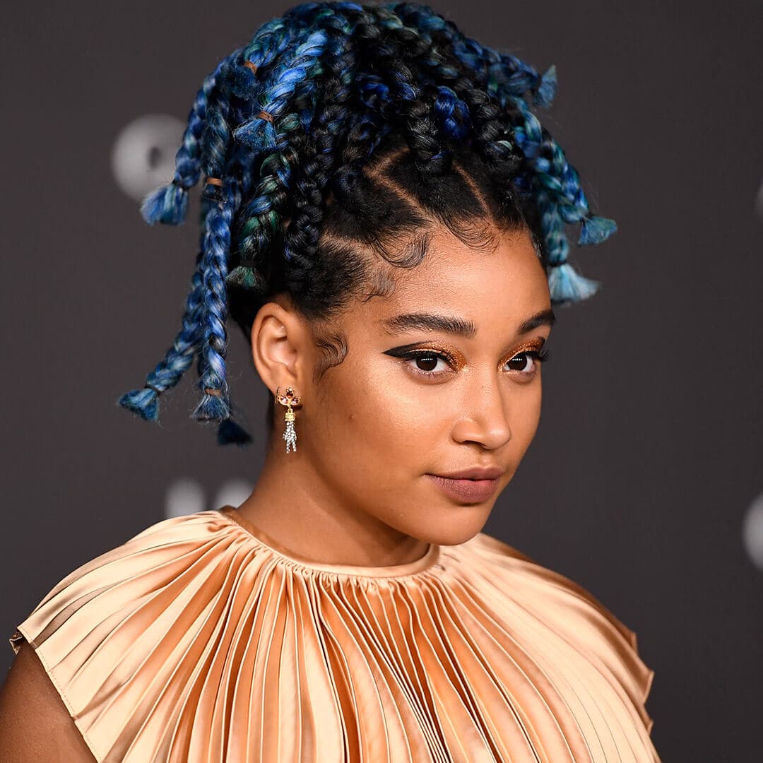 A photo of Amandla Stenberg with blue colored braids