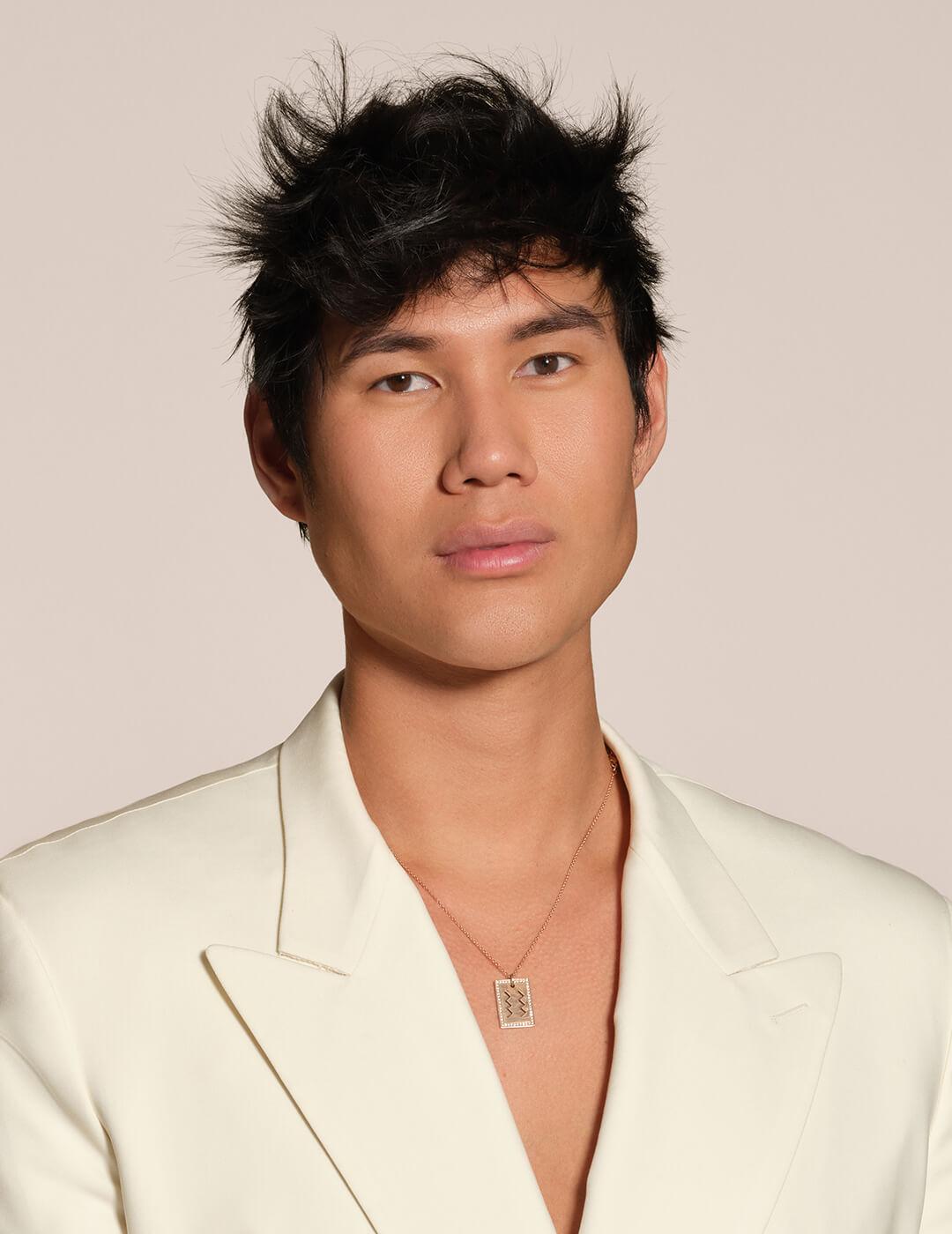 Profile image of Patrick Ta in a cream suit against cream background