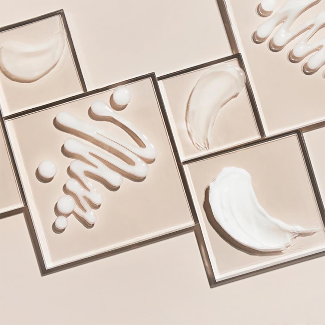 Different moisturizers and creams swatched in square frames on beige background