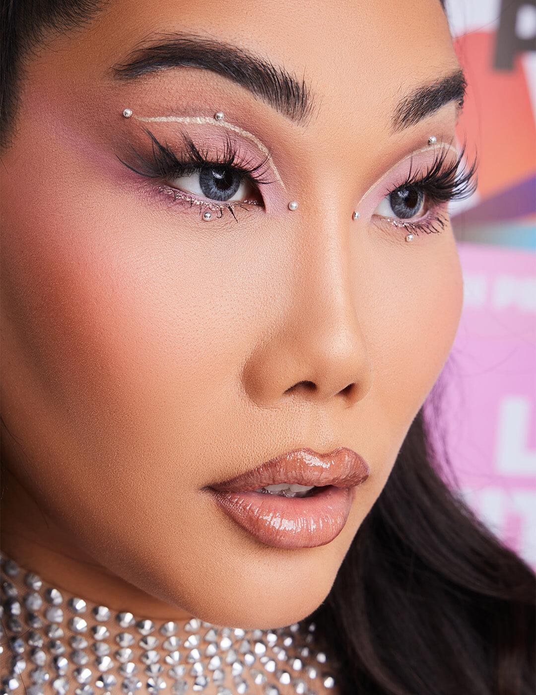Close-up of Gia Gunn rocking a negative space pink eyeshadow makeup look with pearl accents