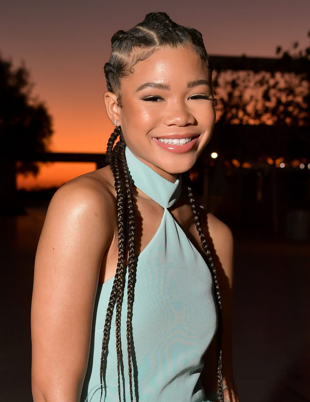 A smiling Storm Reid rocking a goddess braids hairstyle