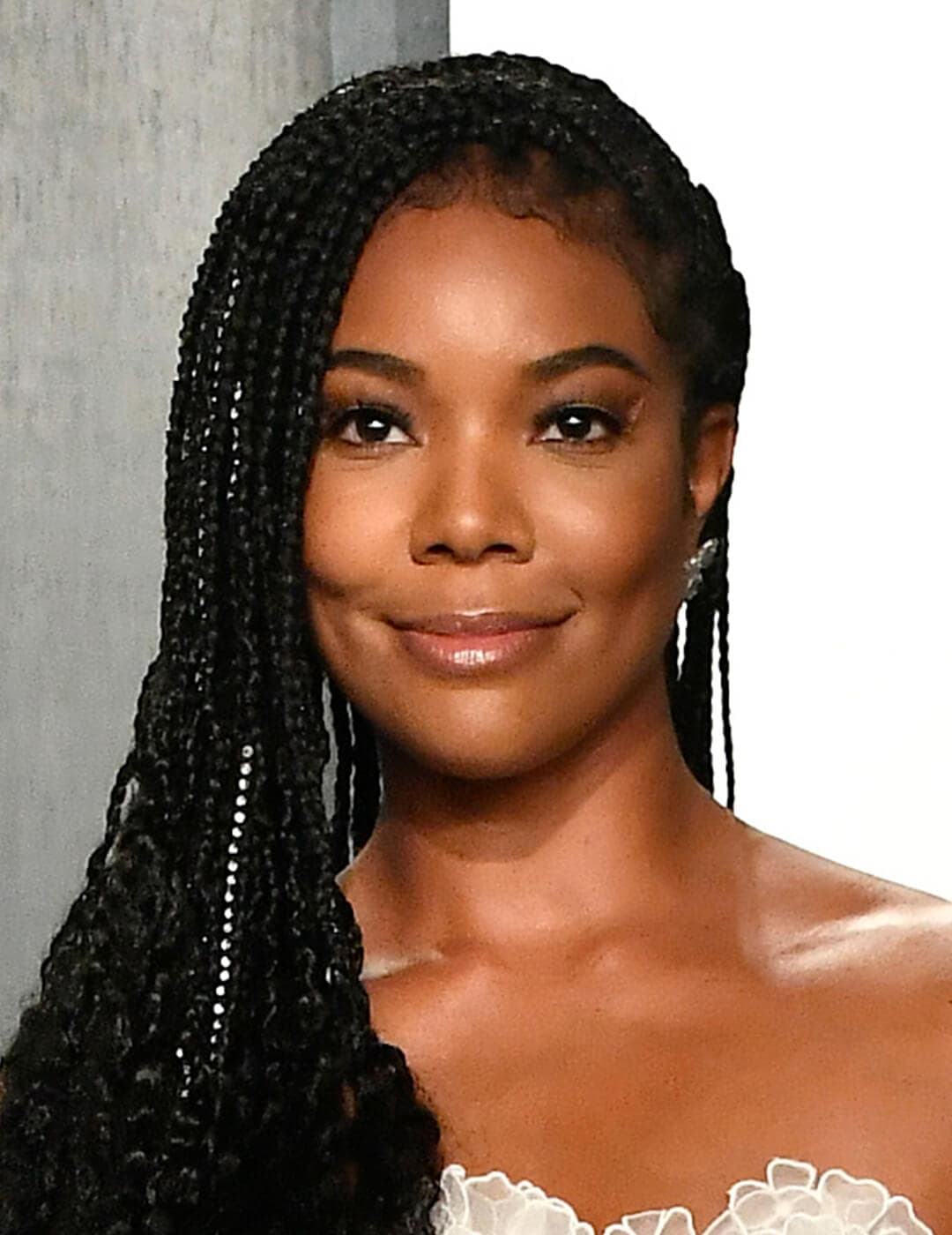 Gabrielle Union looking glam in a braided hairstyle and natural makeup look