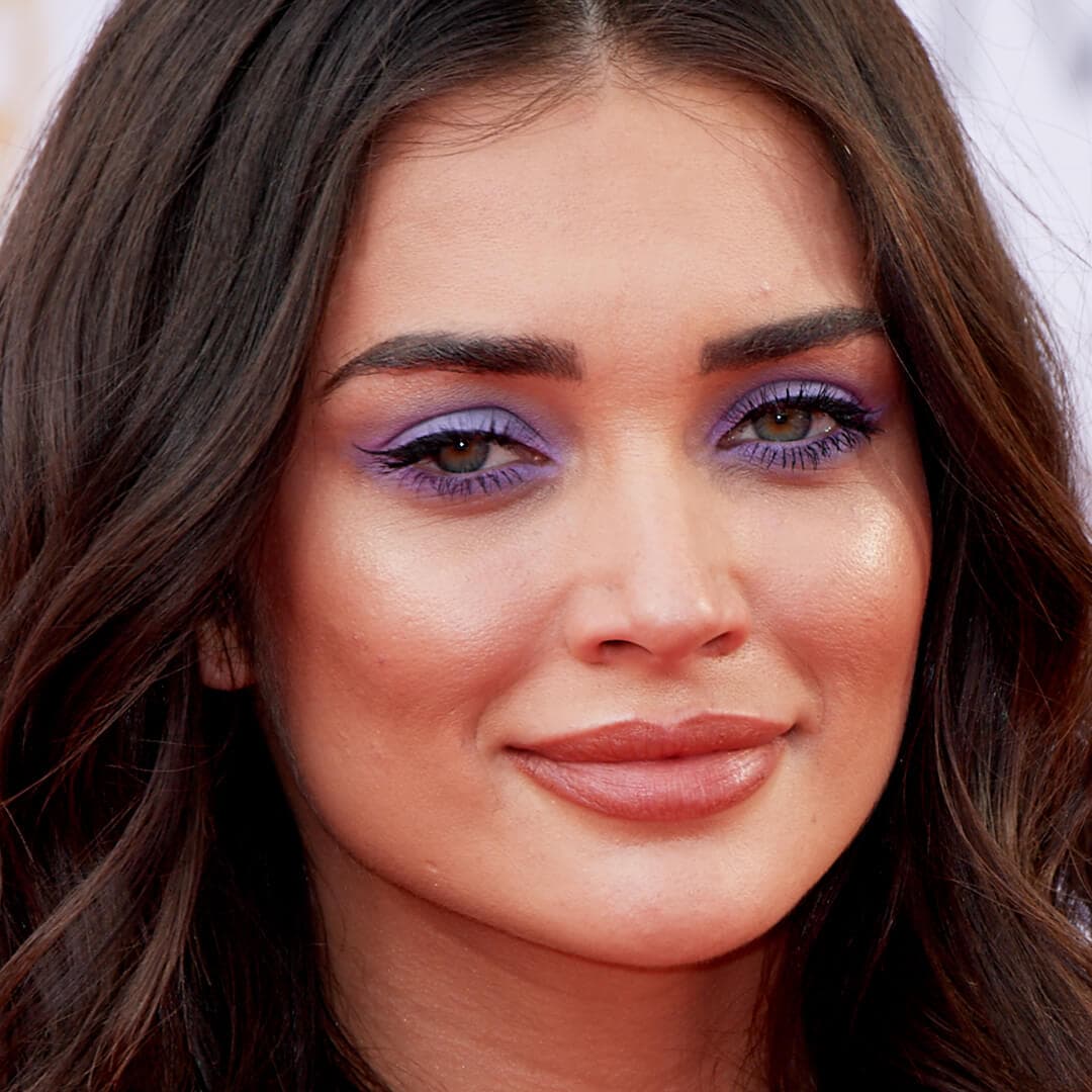 Close-up image of Amy Jackson rocking a shimmery purple and blue eyeshadow look
