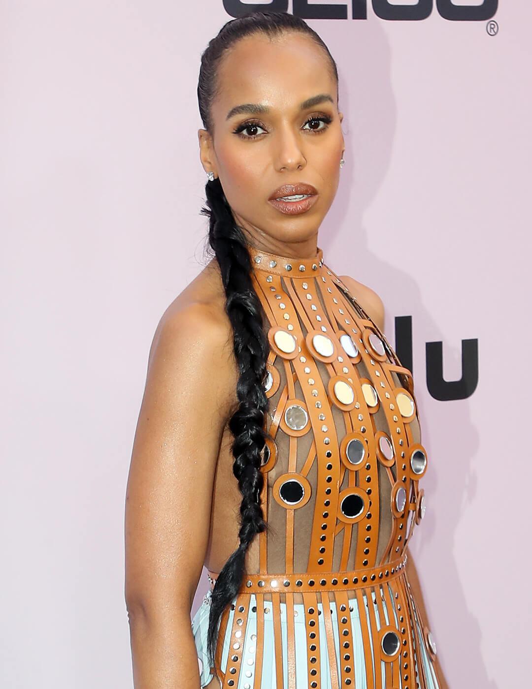 Kerry Washington in caramel leather strapped dress rocking a tousled, side-swept braided ponytail hairstyle