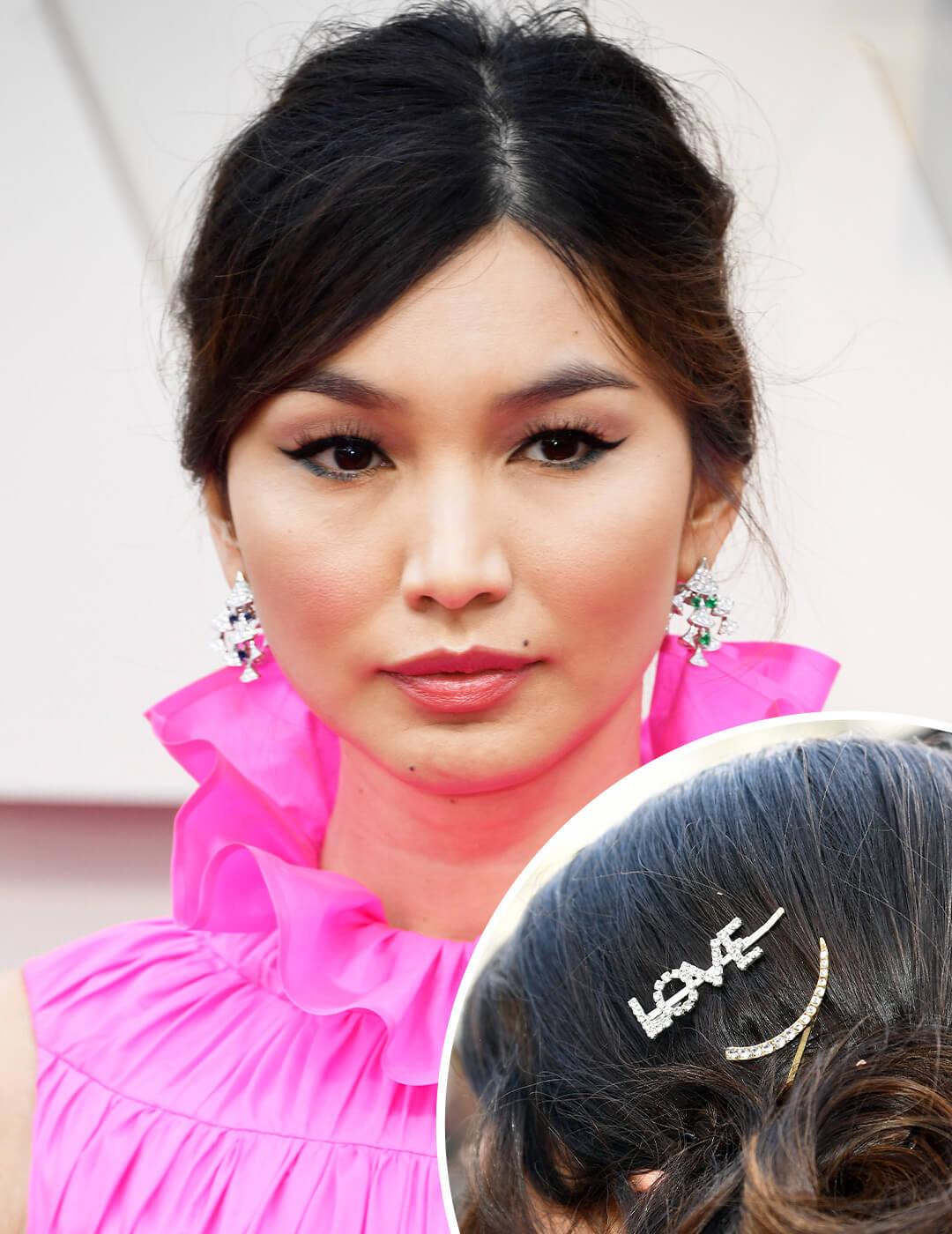 A photo of Gemma Chan with bejeweled barrette that says "LOVE"