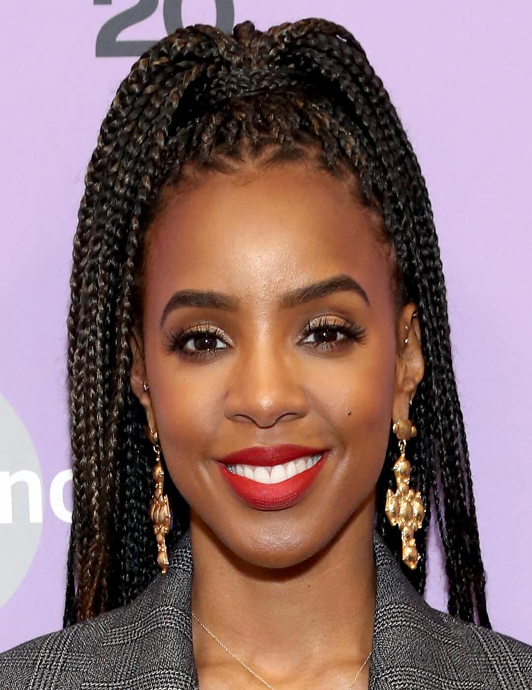 Kelly Rowland rocking a braided high ponytail hairstyle