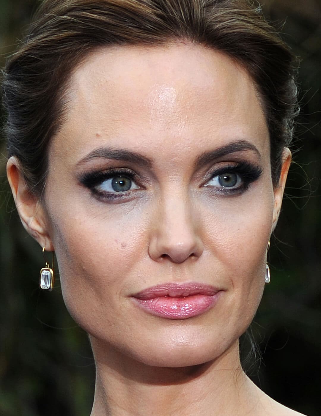 Angelina Jolie with smoky eyeshadow makeup paired with nude pink lips