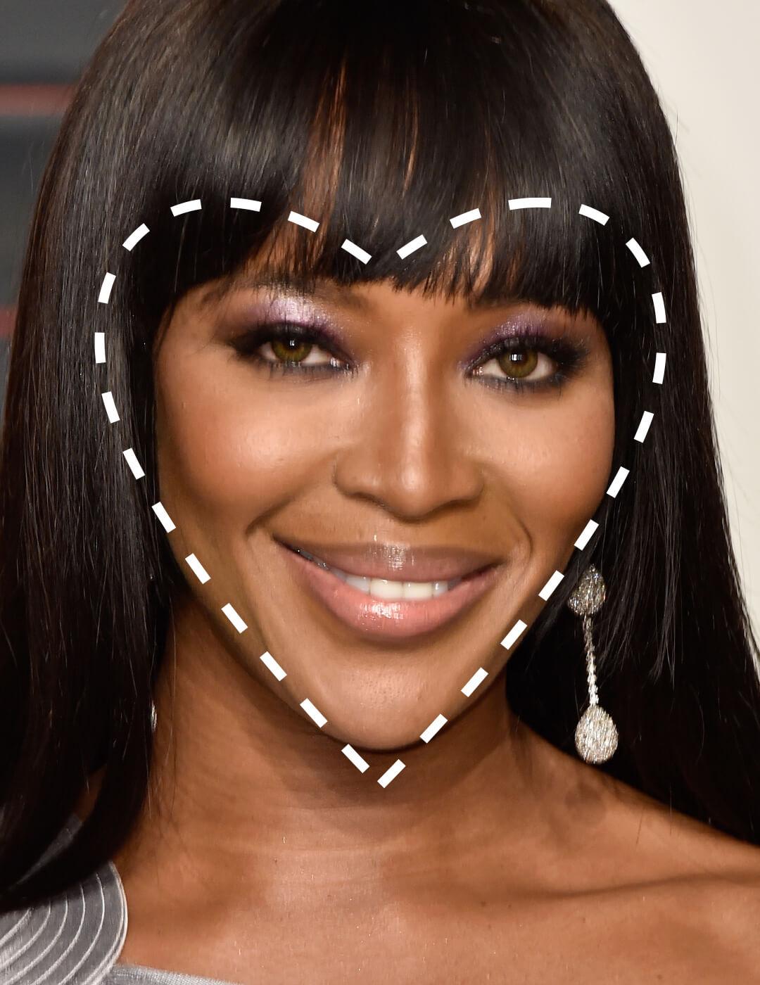 Close-up of a smiling Naomi Campbell with a broken line heart shape overlay