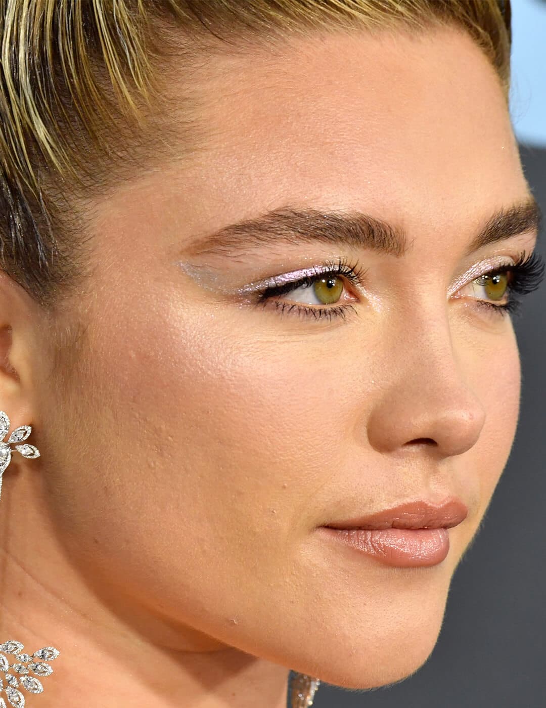 Florence Pugh, jewelry detail, attends the 25th Annual Critics' Choice Awards at Barker Hangar on January 12, 2020 in Santa Monica, California
