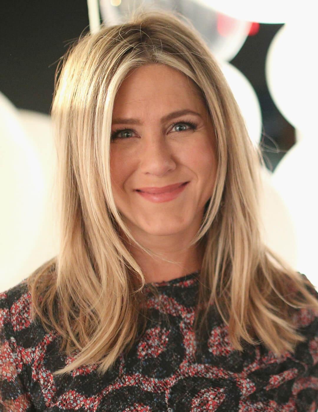 A photo of Jennifer Aniston with a face-framing layer hairstyle