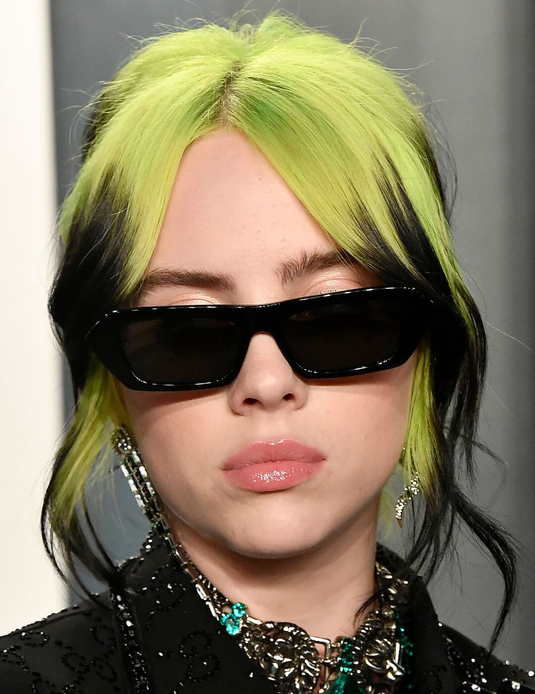 A photo of Billie Eilish with her iconic green skunk hair
