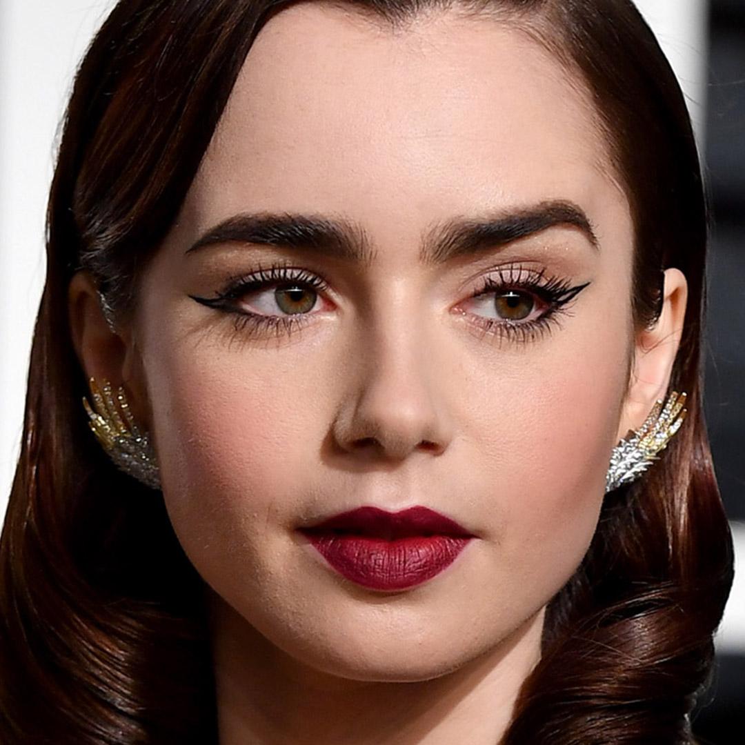 A photo of Lily Collins with a double wing and a bold red lip