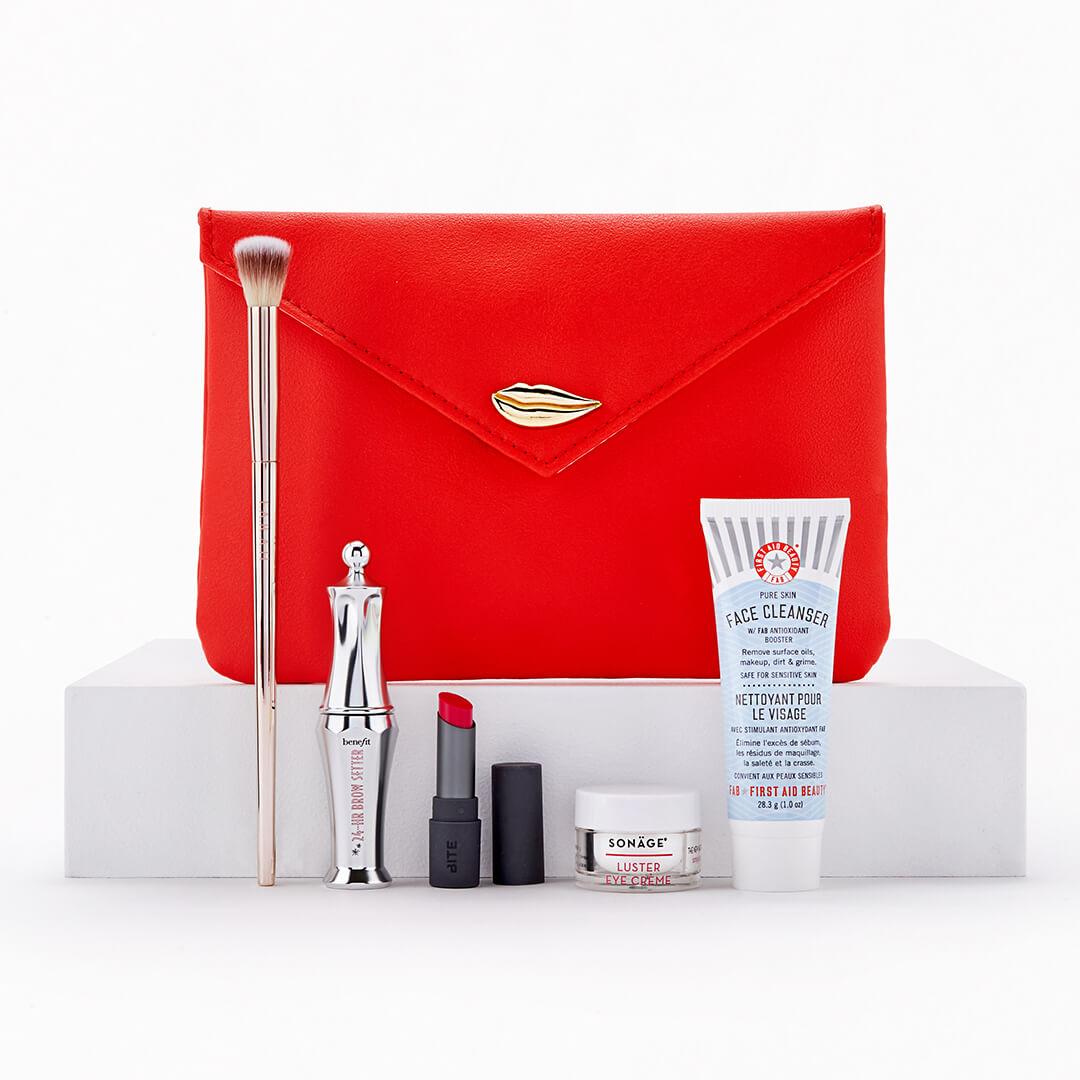 February 2021 Glam Bag and skincare and makeup products and tools on white background