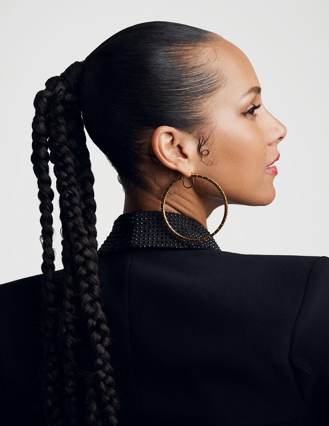 Portrait of Alicia Keys with her back to the camera
