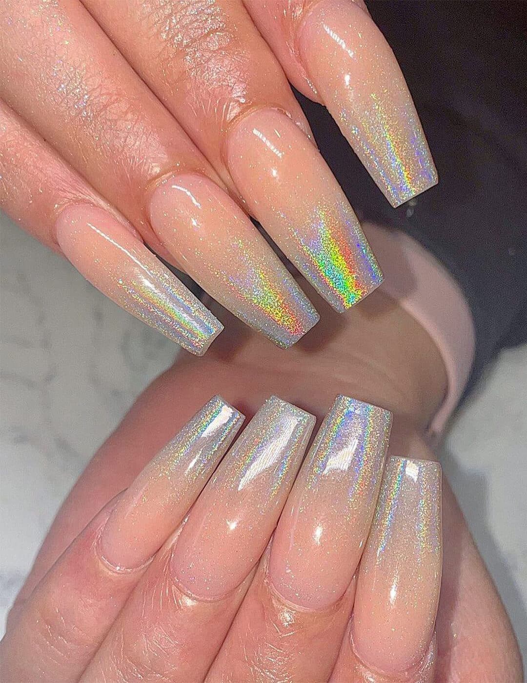 Close-up of woman's holographic ombré nail art