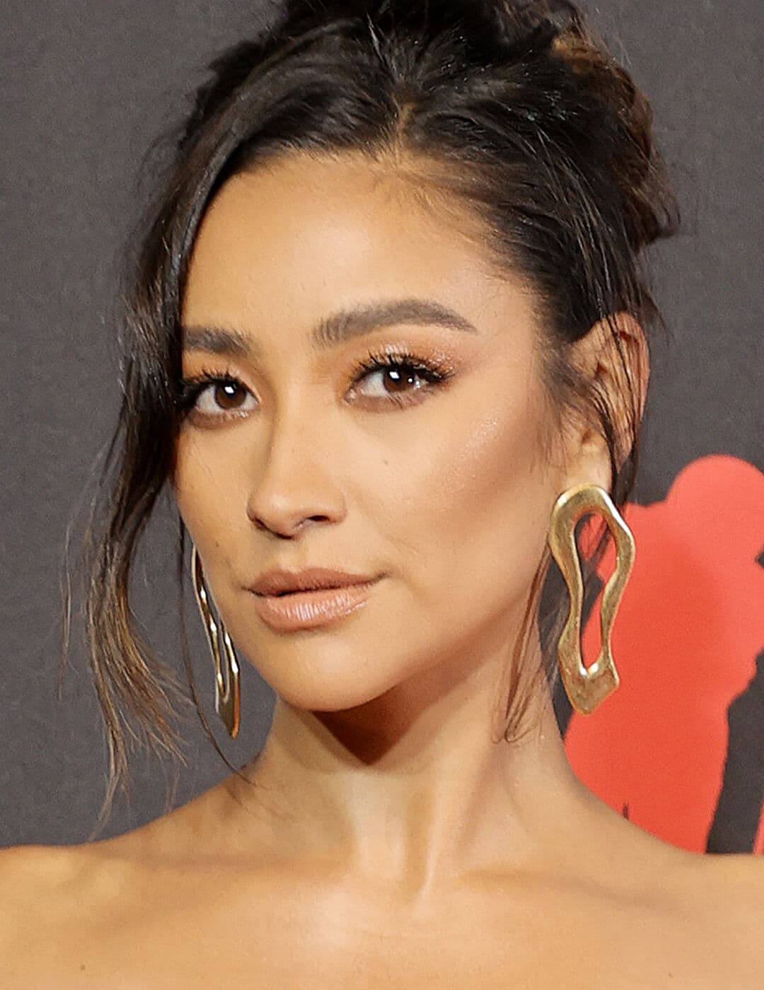 Shay Mitchell rocking a glossy eye makeup look paired with glossy lips