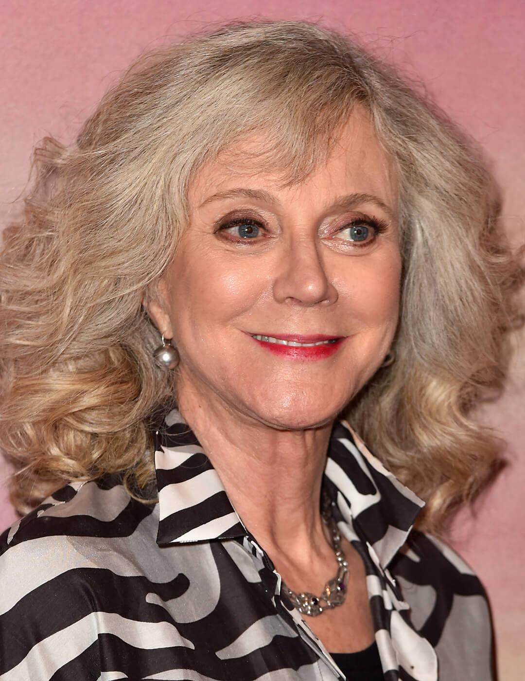 A photo of Blythe Danner with natural beachy waves hairstyle