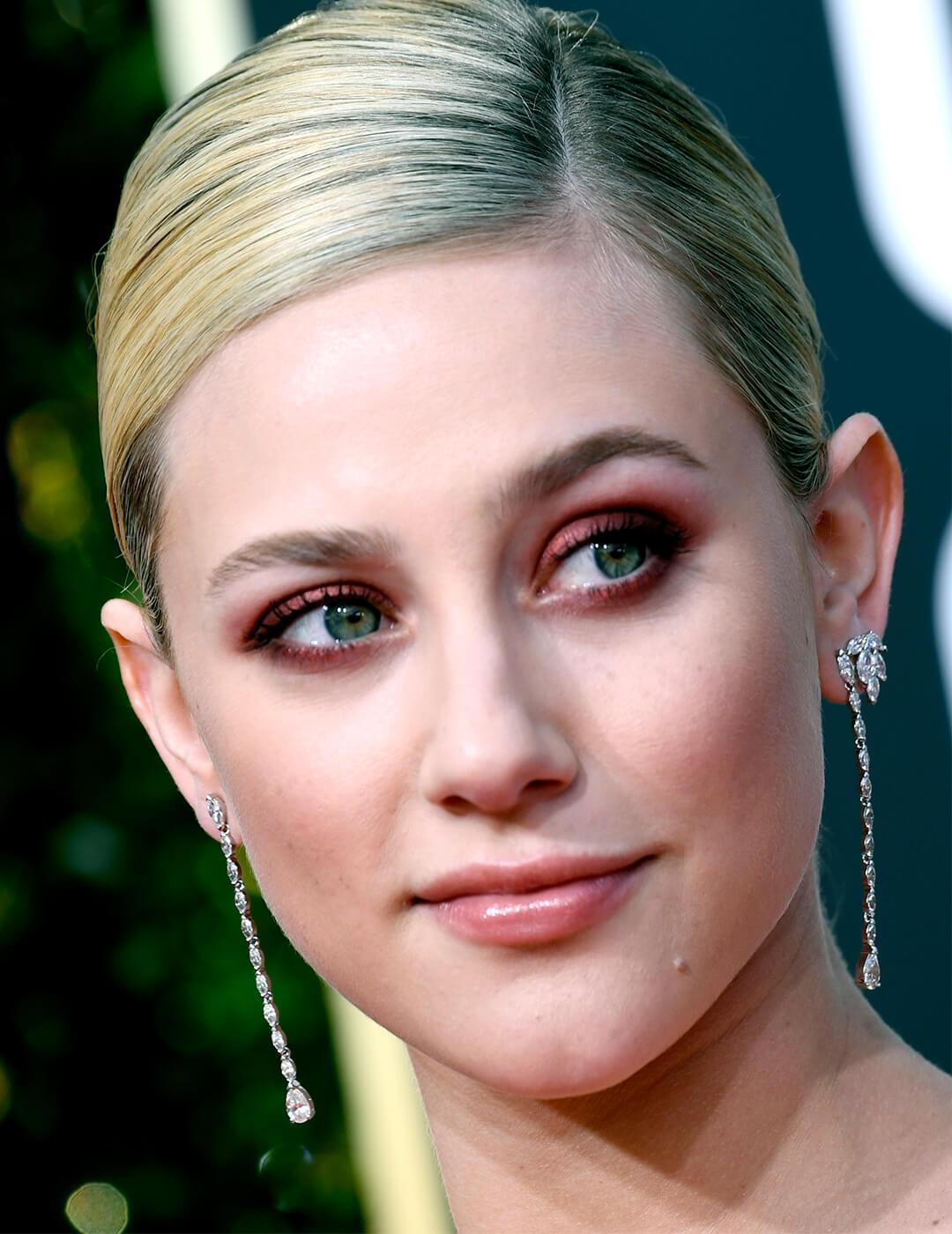 Close-up of Lili Reinhart rocking a cranberry and burgundy eyeshadow look