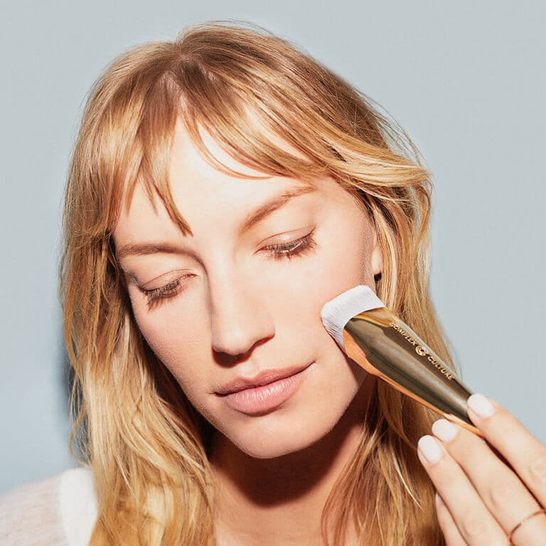 A model using the COMPLEX CULTURE Angled Foundation Brush