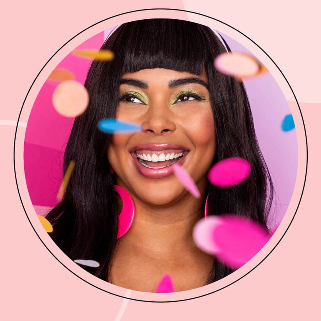 Profile image of a smiling Tabria Majors with confetti inside pink frame