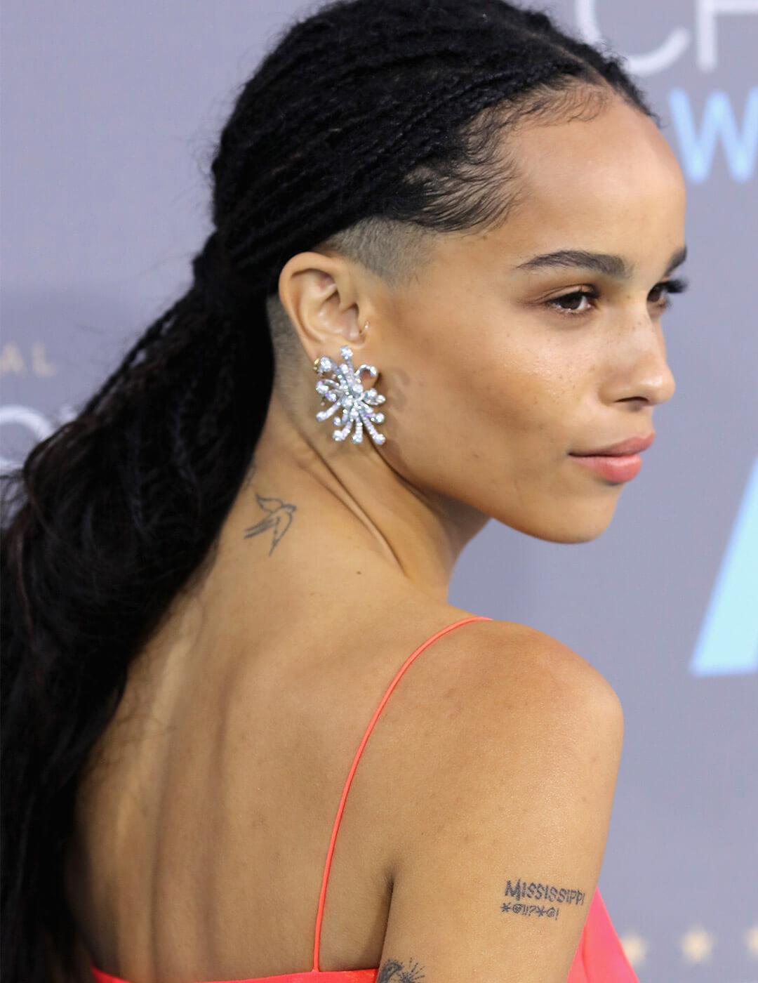 A photo of Zoe Kravitz with braids with half-shave hairstyle