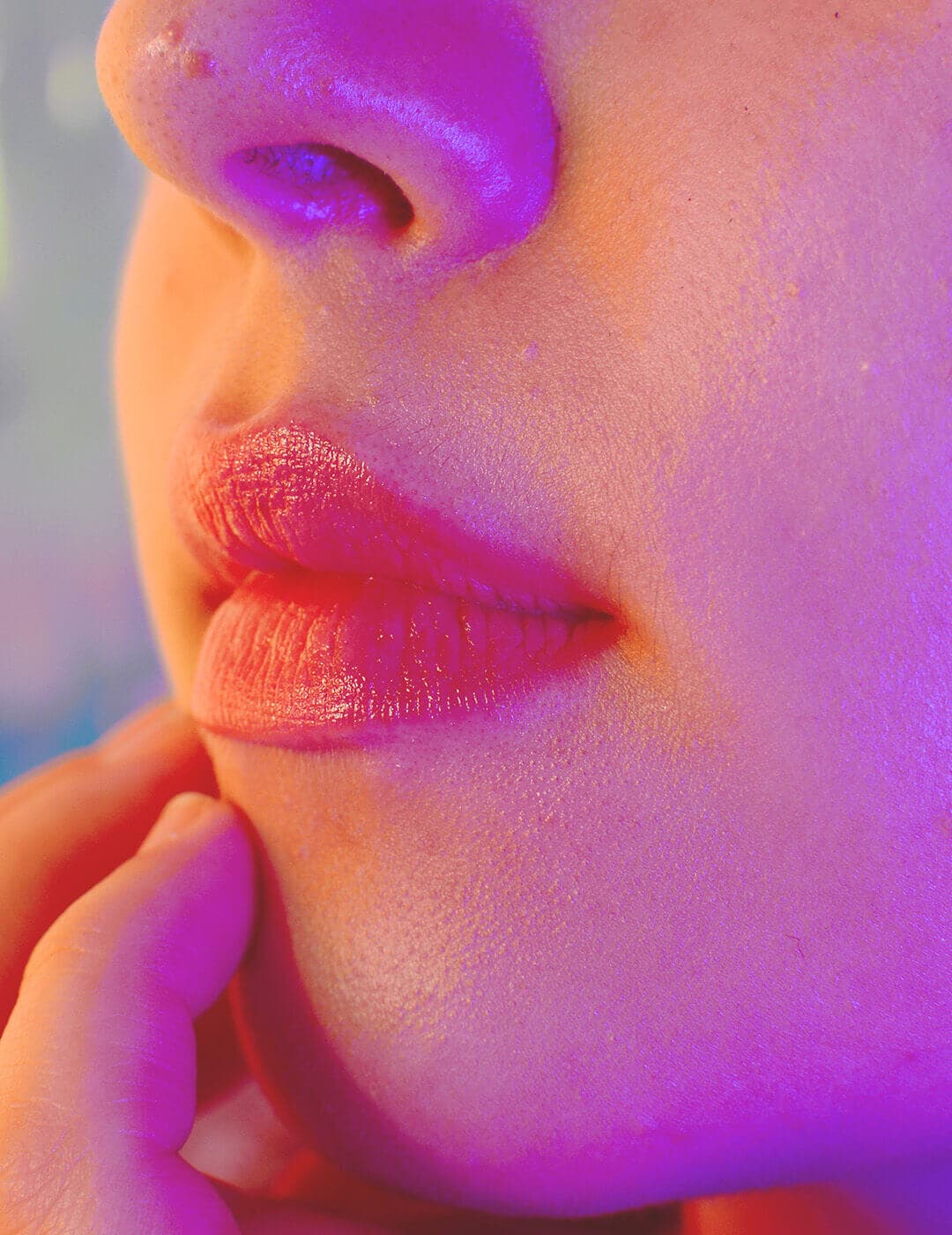 A close-up image of a woman's rosy lips while she undergoes a snow mushroom skincare routine, enhancing the radiance of her clear skin