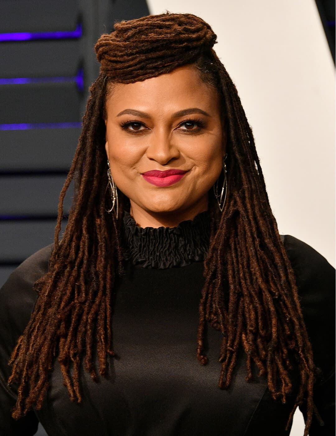 Ava DuVernay rocking her locs while smiling