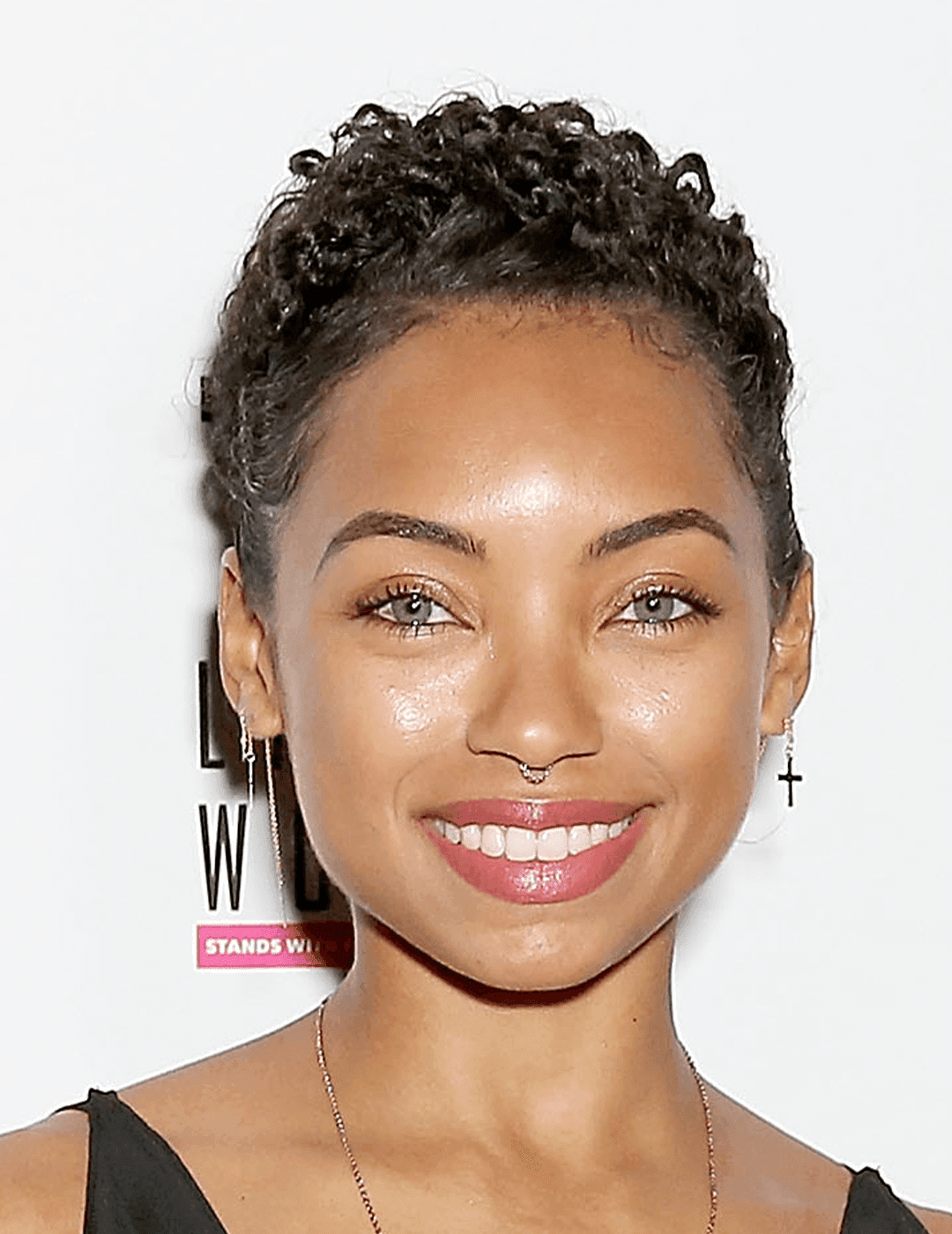 Actress Logan Browning sporting a no-makeup makeup look and curly pixie hairstyle