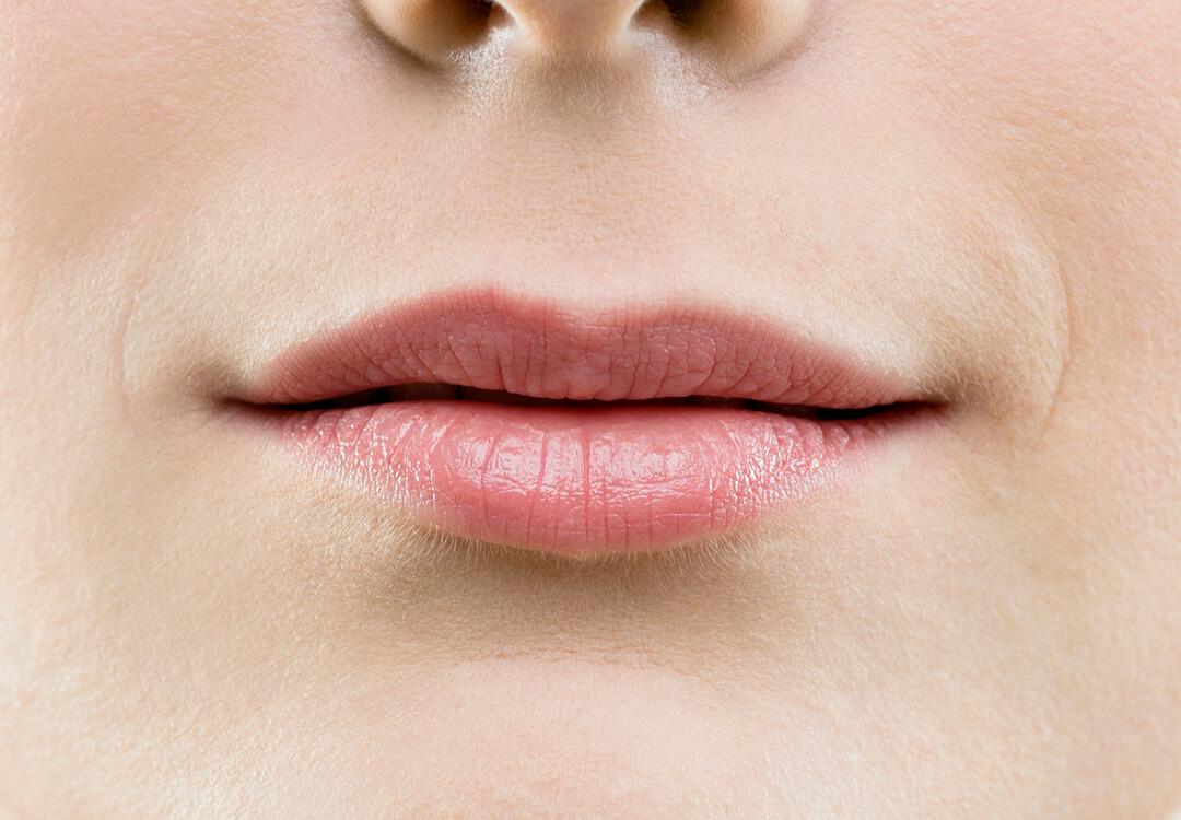 Close-up of a woman's thin lips