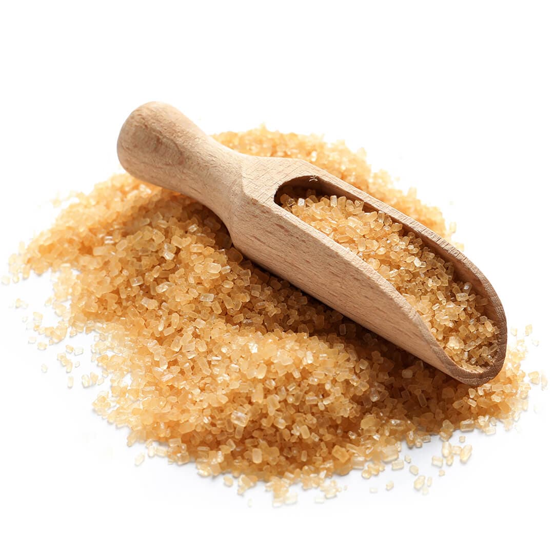 Image of brown sugar and wooden scoop on white background
