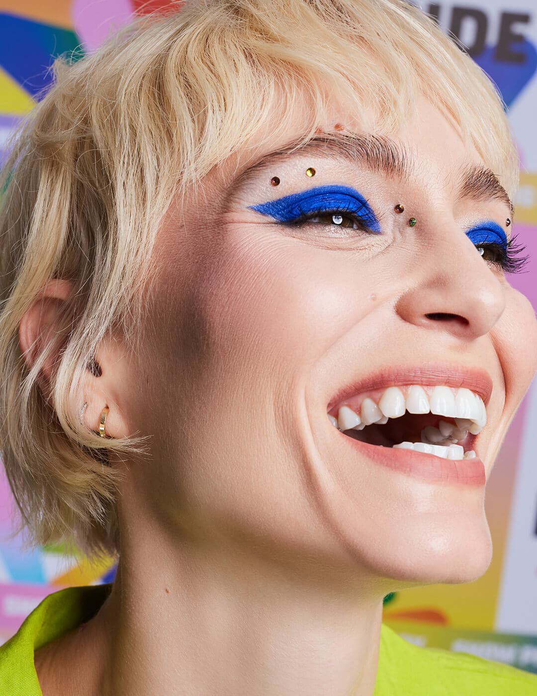 Close-up of Alex Boldea rocking a cobalt blue winged eyeshadow makeup look