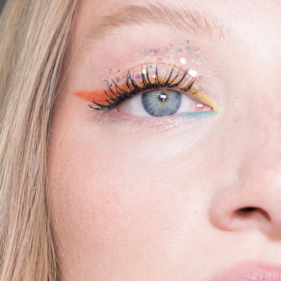 Close-up image of a tropical winged eyeliner look on Ash Walker