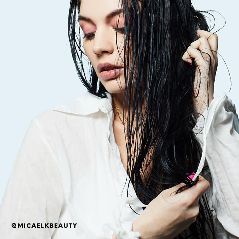 Micaela Klein washes her hair with leave-in conditioner.