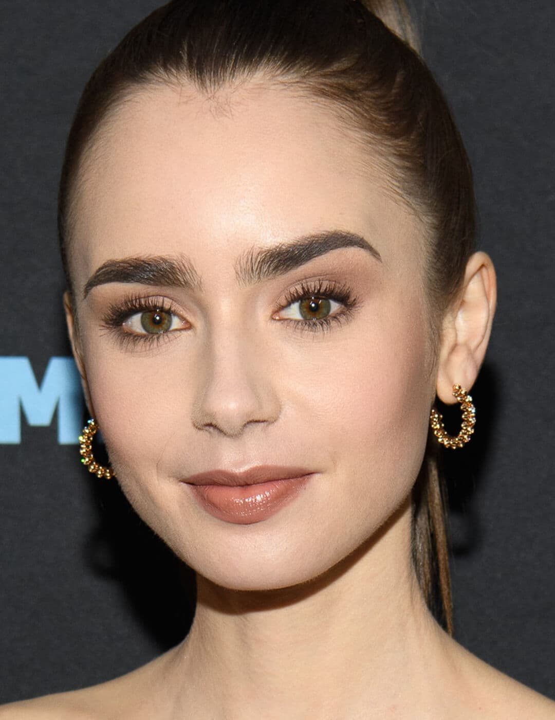 Close-up of Lily Collins with a monochromatic makeup look
