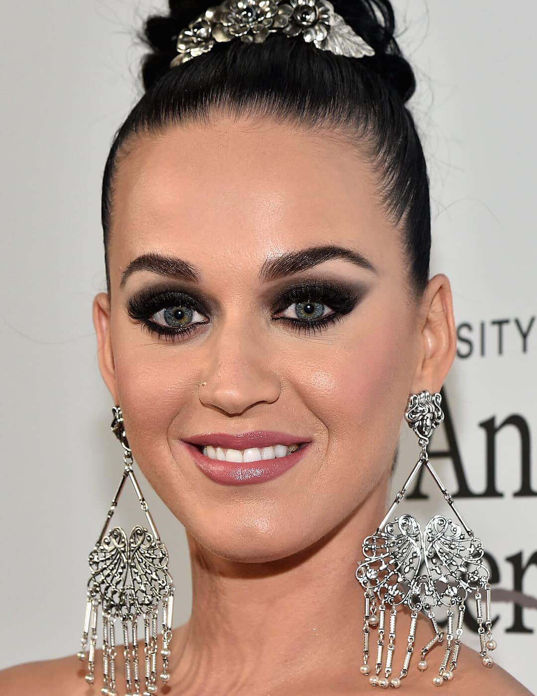 Katy Perry rocking a gradient smoky eye makeup look and silver dangling earrings on the red carpet