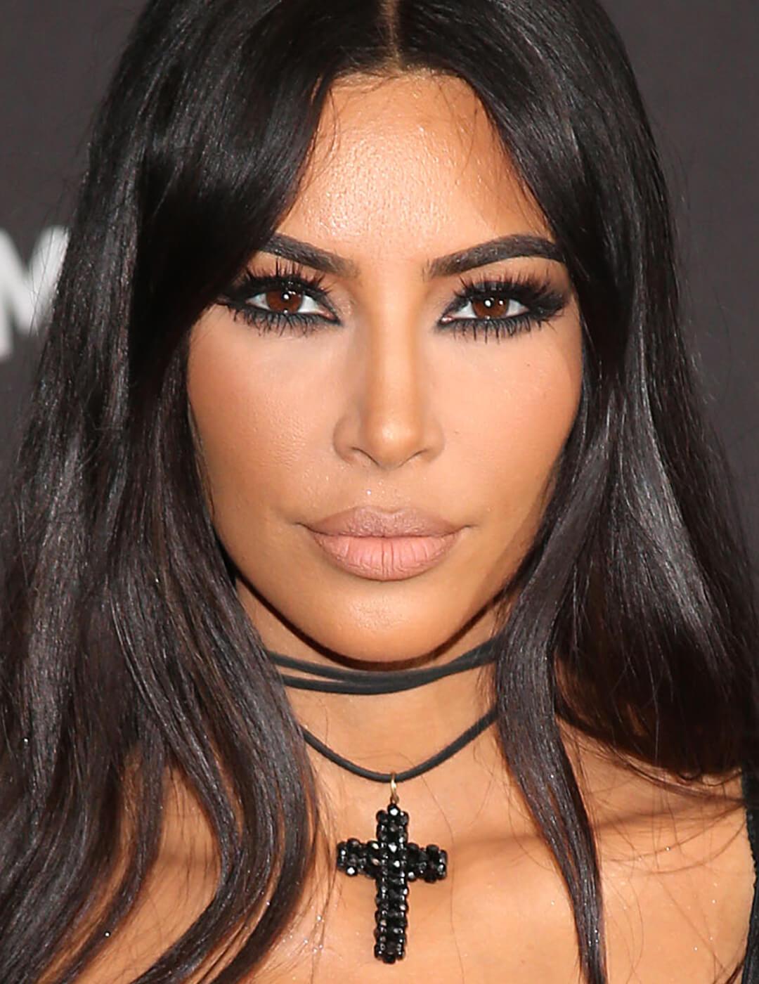 Kim Kardashian looking edgy in a dark eye makeup look