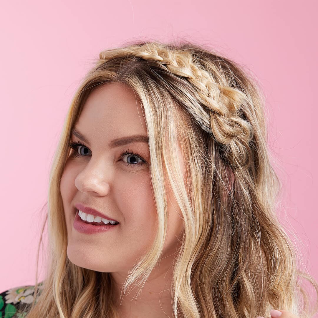 An image of a model wearing a braided headband look.