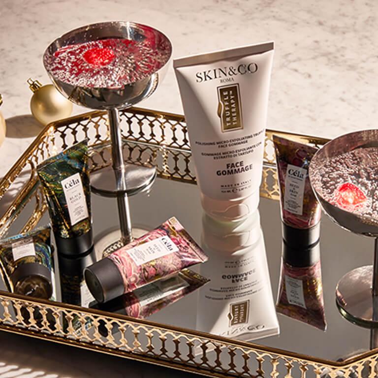 An image of skincare products on a mirror tray