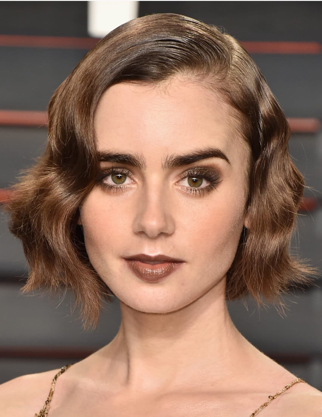 Lily Collins sporting a deep brown monochromatic makeup look