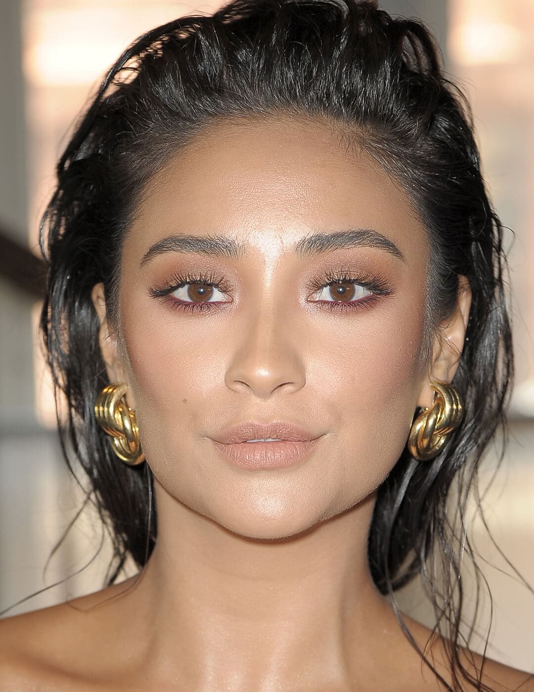 Close-up of Shay Mitchell rocking a neutral eyeshadow and burgundy eyeliner makeup look