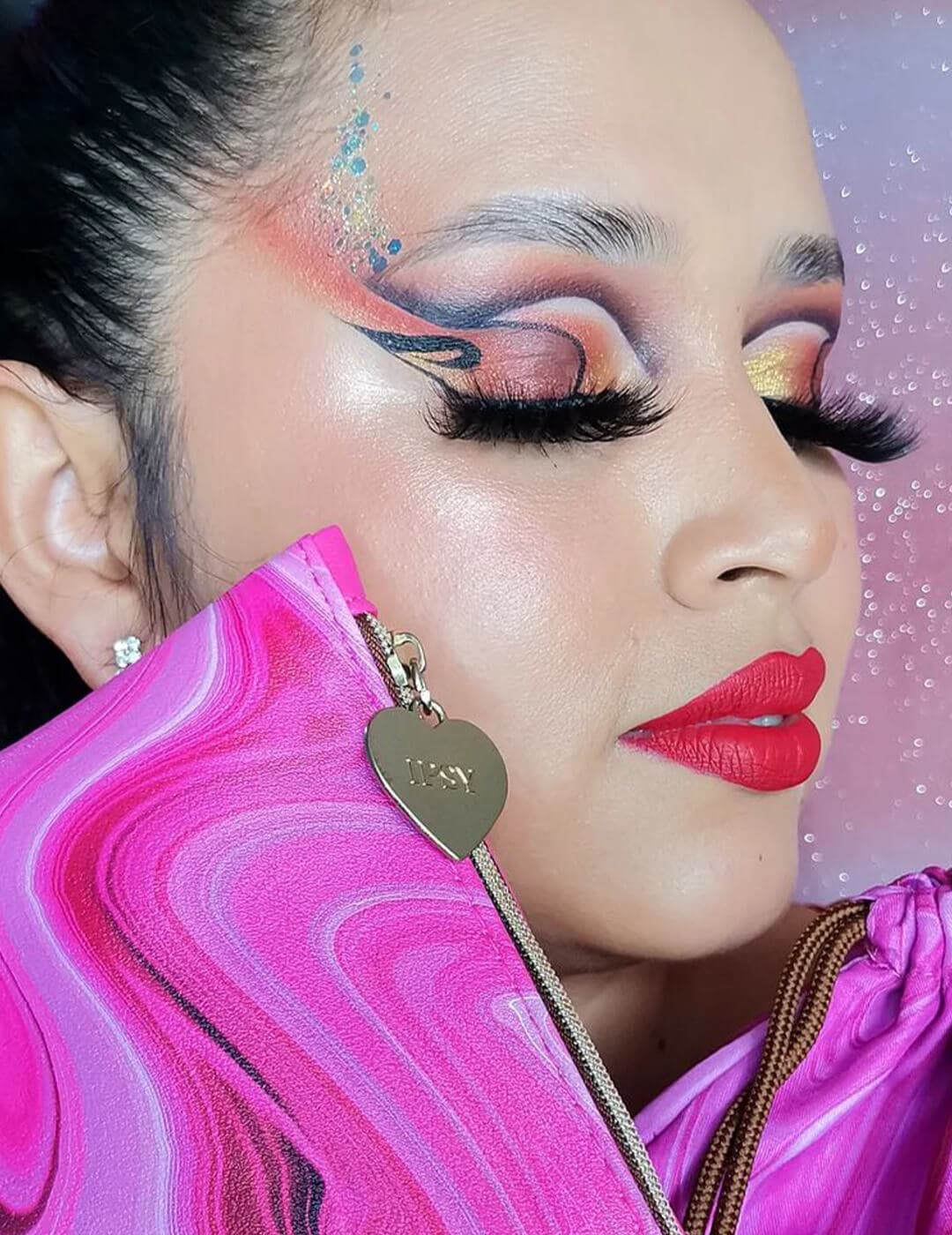 Close-up of a woman's colorful and graphic marbled eye makeup look